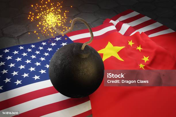 Ignited Cannon Bomb On The Flags Of The Usa And China Stock Photo - Download Image Now