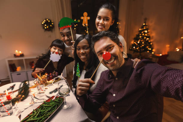 istock friends taking selfie on christmas dinner at home 1418167660