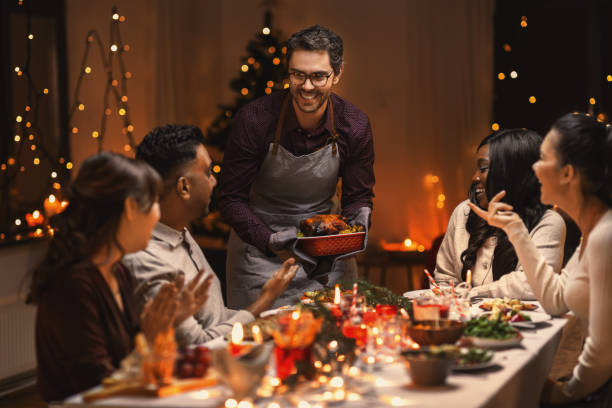 istock happy friends having christmas dinner at home 1418167940