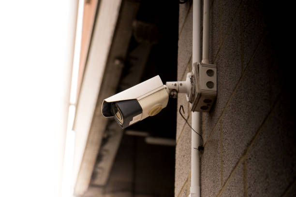 istock Closeup facade video surveillance camera monitoring security 1418168674