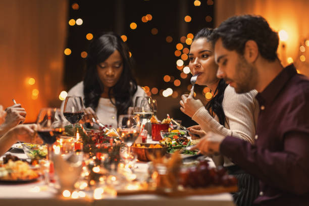 istock happy friends having christmas dinner at home 1418168957
