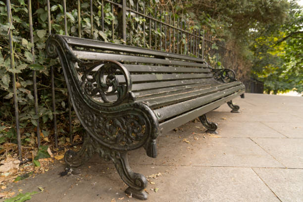 istock park bench fence hedges trees wrought ornate 1418169140