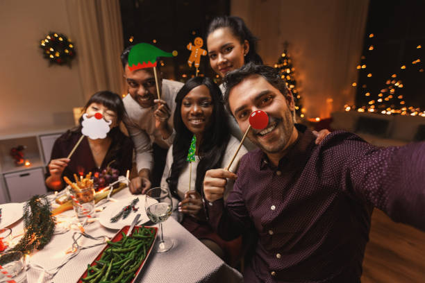 istock friends taking selfie on christmas dinner at home 1418169319