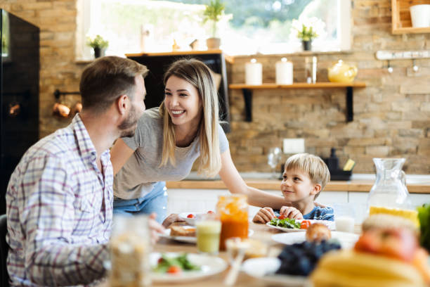 istock Happy family  talking during breakfast  time at dining table 1418169645