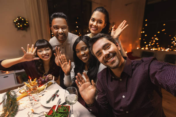 istock friends taking selfie on christmas dinner at home 1418169901