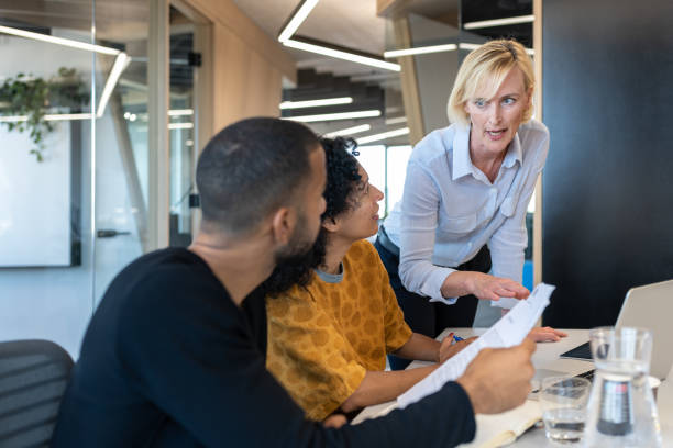 istock Business people of different races working at a modern office 1418170055