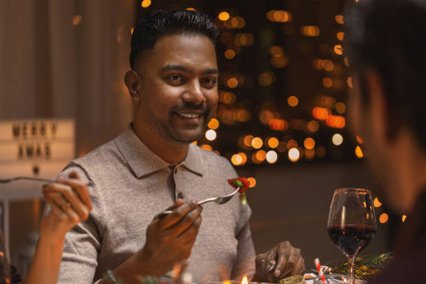 istock happy man having christmas dinner at home 1418170662