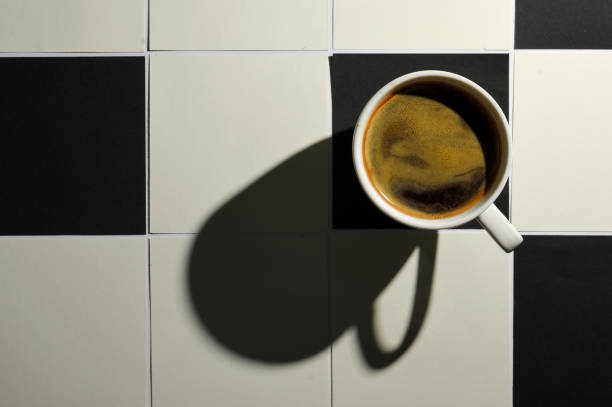 White And Black Square Tiled Paper and Coffee Cup stock photo