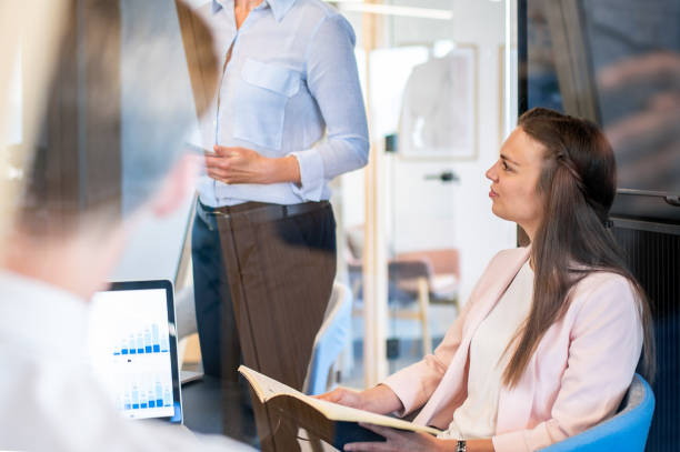 istock Brainstorming of colleagues about issues in a modern startup office and a conference room. 1418172679