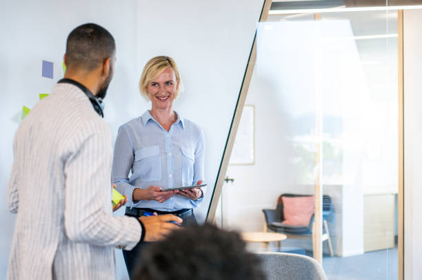 istock Brainstorming of colleagues about issues in a modern startup office and a conference room. 1418172739