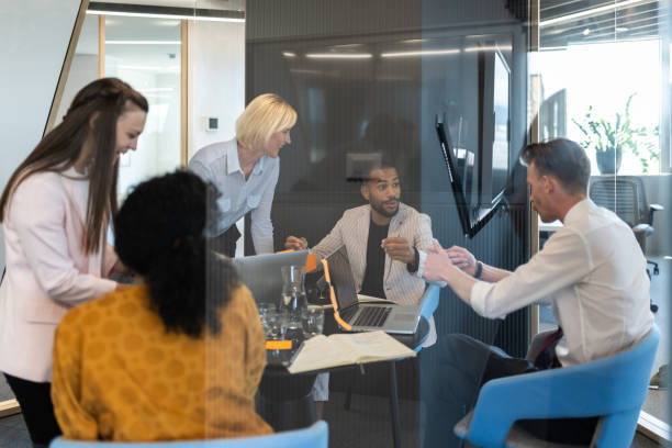istock Brainstorming of colleagues about issues in a modern startup office and a conference room. 1418172757