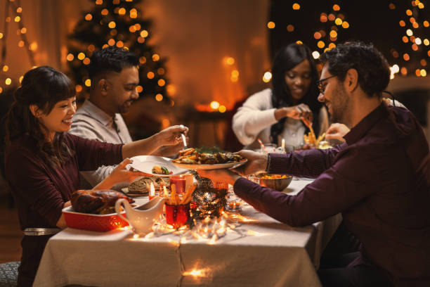 istock happy friends having christmas dinner at home 1418172833