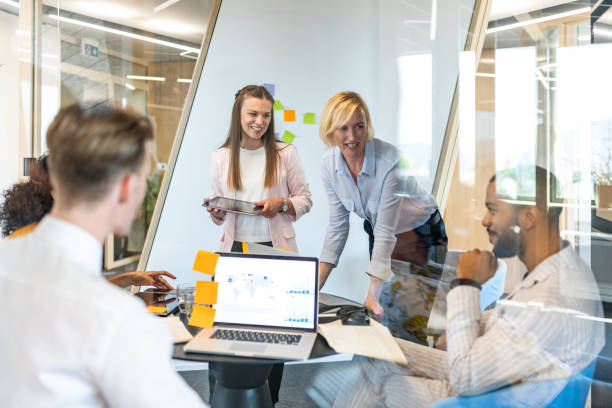 istock Brainstorming of colleagues about issues in a modern startup office and a conference room. 1418172848