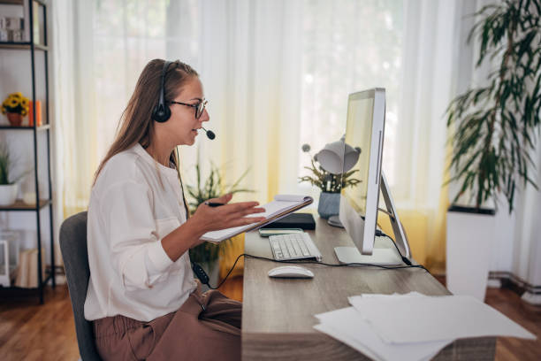 istock Woman working from home on computer and having remote meeting 1418173311