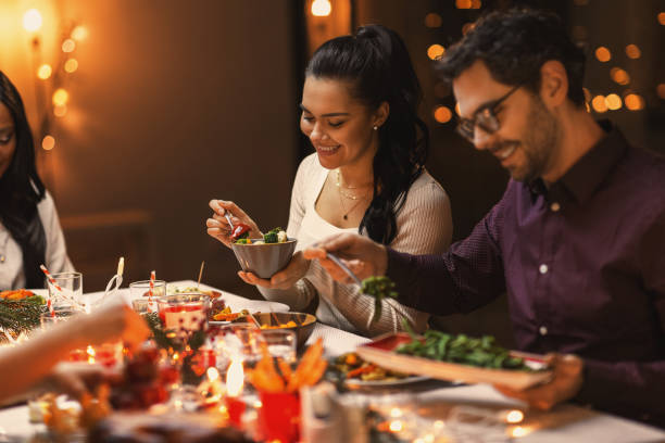 istock happy friends having christmas dinner at home 1418173873