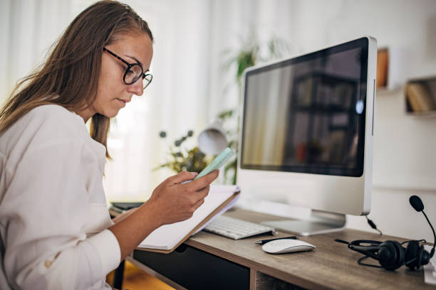 istock Woman working on the computer at home office 1418174491