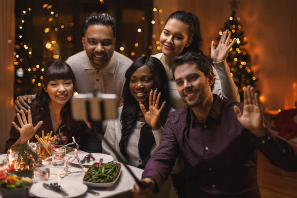 istock friends taking selfie on christmas dinner at home 1418174715