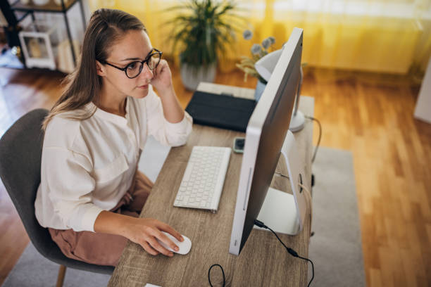 istock Woman working on the computer at home office 1418174855