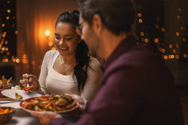 istock happy friends having christmas dinner at home 1418175326