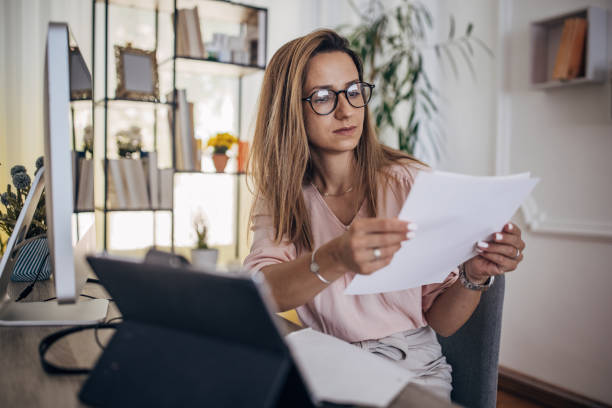 istock Woman working on the computer at home office 1418176055