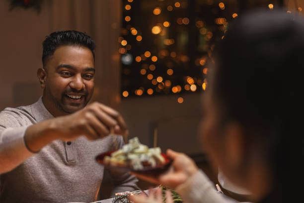 istock happy man having christmas dinner at home 1418176188