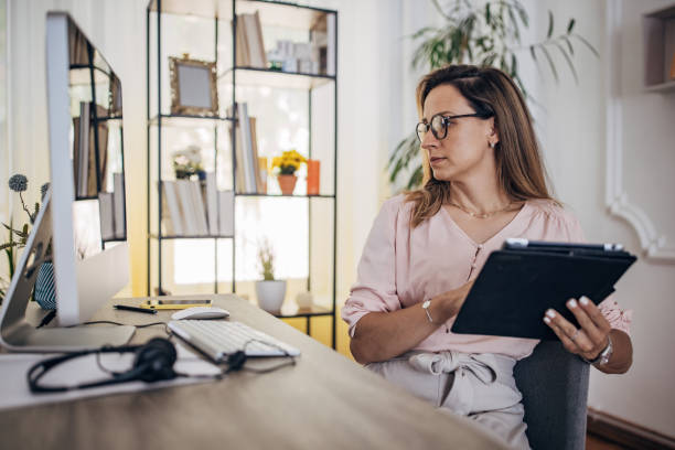 istock Woman working on the computer at home office 1418176269
