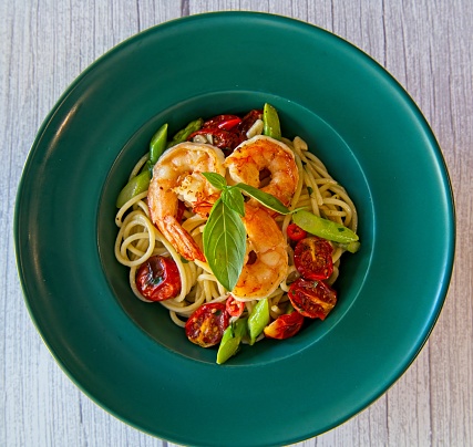 Creamy Italian style pasta with shrimps and air dried tomatoes and asparagus.
