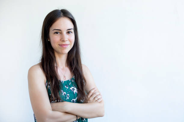 istock young smiley woman looking at camera 1418178849
