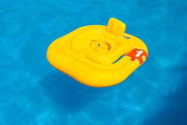 istock Yellow float in the pool in summer for babies of one year, so that they float 1418179679