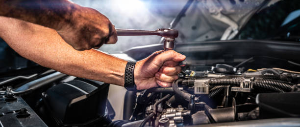 istock Auto mechanic working in garage. Repair service. 1418179773