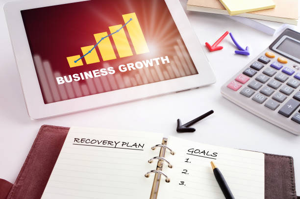istock Business growth graph on computer digital tablet and calculator 1418183460