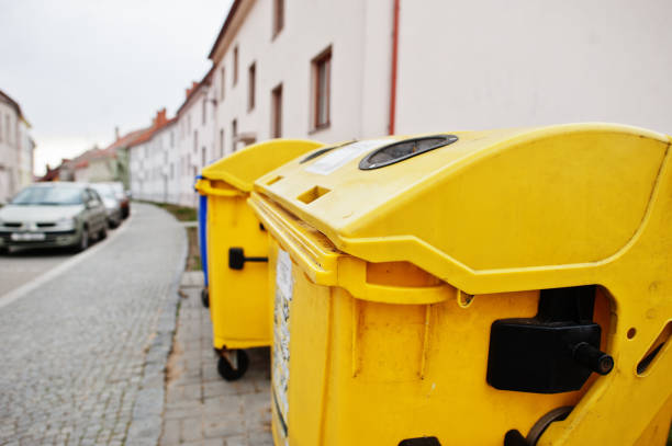 istock Yellow trash cans for plastic in street. 1418183896
