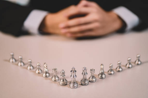 istock The competition challenge of business by chessboard. solution strategy game concept. Decision by leadership battle of intelligence and management for team success. Opportunity of move to the winner. 1418184723
