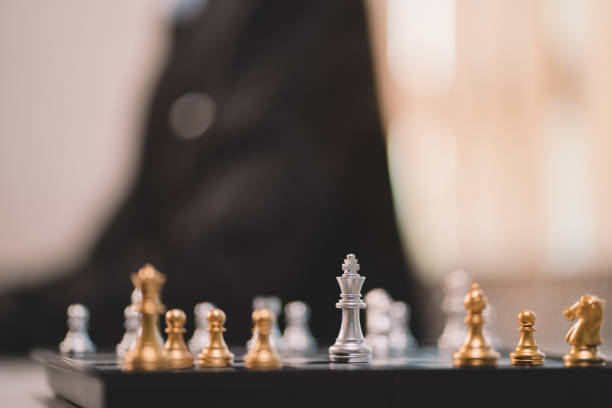 istock The competition challenge of business by chessboard. solution strategy game concept. Decision by leadership battle of intelligence and management for team success. Opportunity of move to the winner. 1418184732