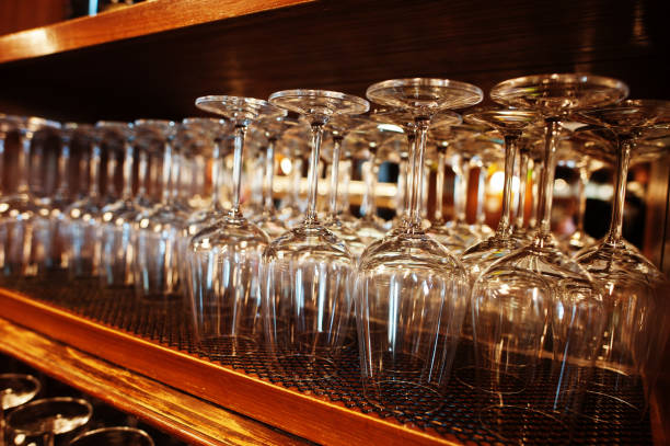 istock Glasses of wine upside down at bar counter. 1418184943