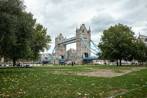 Tower Bridge with Thames river during oevercast day in London