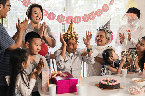 Big group of Asian family birthday party at home with happiness