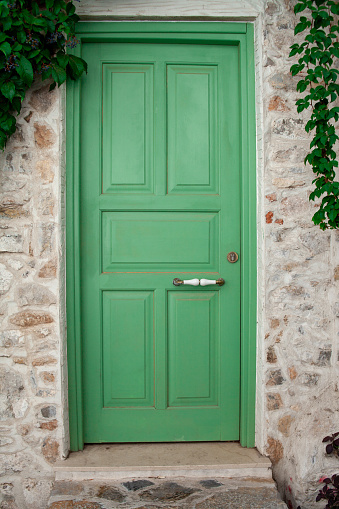 Front Door of a Old Stone House. Green Street Door Close Up