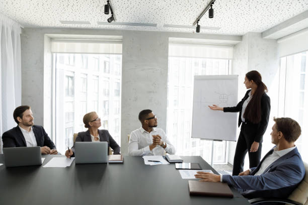 istock Concentrated professional millennial female speaker giving educational lecture. 1418192873