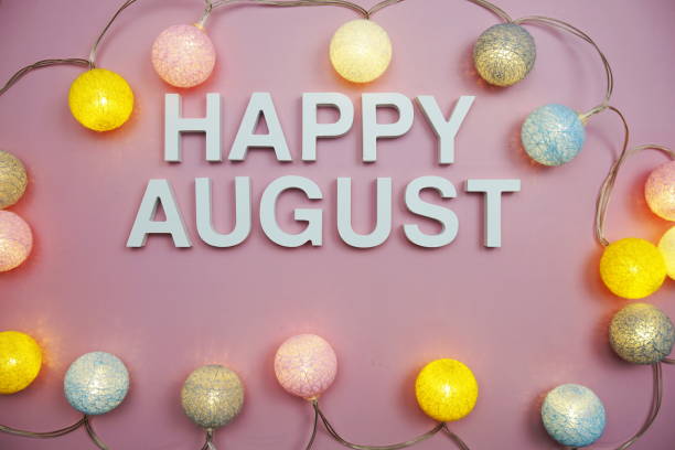 istock Happy August alphabet letters on pink background 1418192926