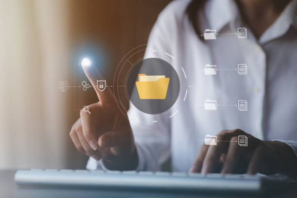 istock business man typing on a keyboard with holograms of digital document files, data files on computers stored as cloud databases can be viewed online and prevented data loss from the device. 1418193156