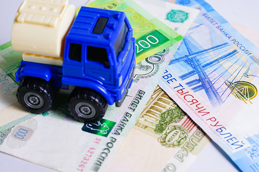 Toy car on​ Russian​ rubber banknotes, Business finance concept.