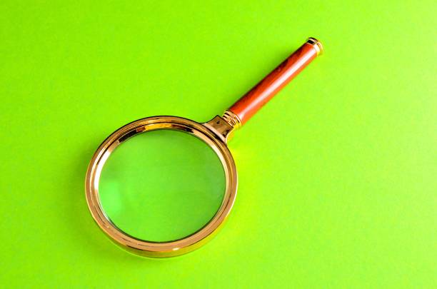 Magnifying glass on yellow background