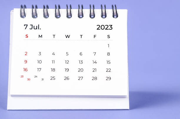 The July 2023 Monthly desk calendar for 2023 year on purple background. stock photo