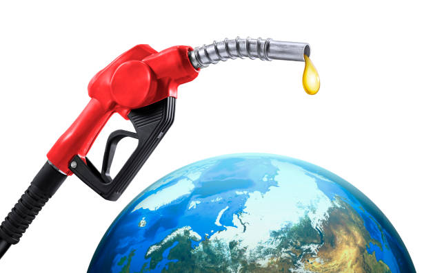 istock gas pump nozzle and globe 1418197494