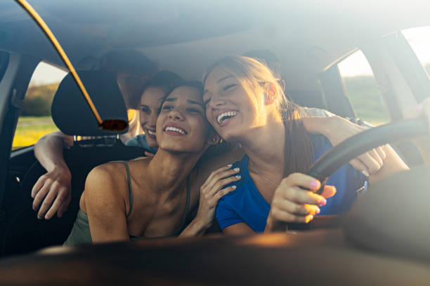 istock Girlfriends traveling with car and having fun. 1418197696