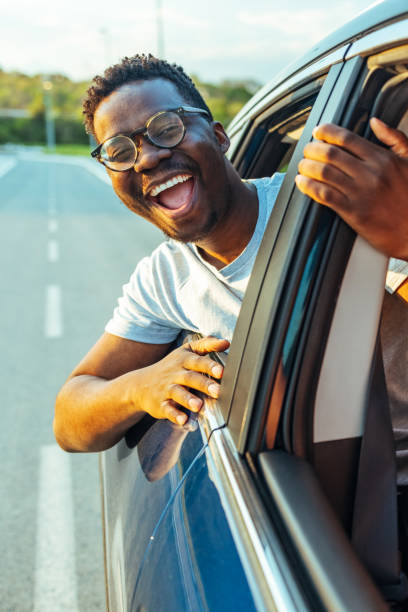 istock Handsome man enjoying a car ride 1418197703