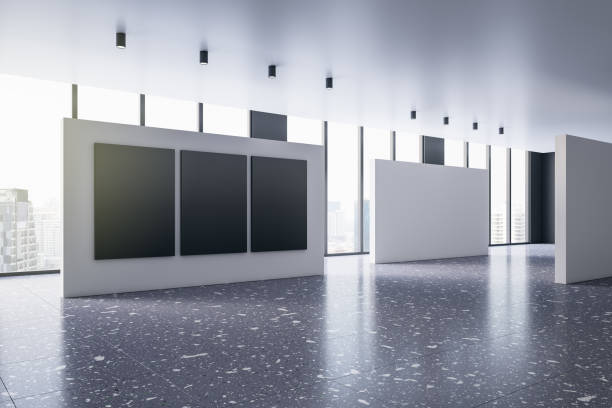 istock Clean bright gallery interior with mock up posters and windows with city view. 3D Rendering. 1418198242