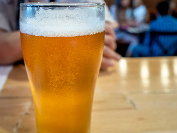 istock Glass of ice cold beer on a bar counter 1418200830
