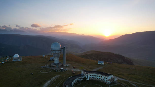 istock Two large telescope domes at sunset. Drone view 1418201066